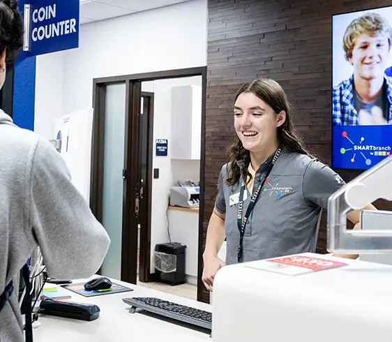 High school students at the counter of a CUTX Smart Branch